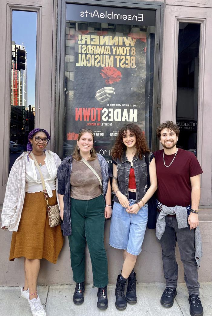 students standing in front of theatre